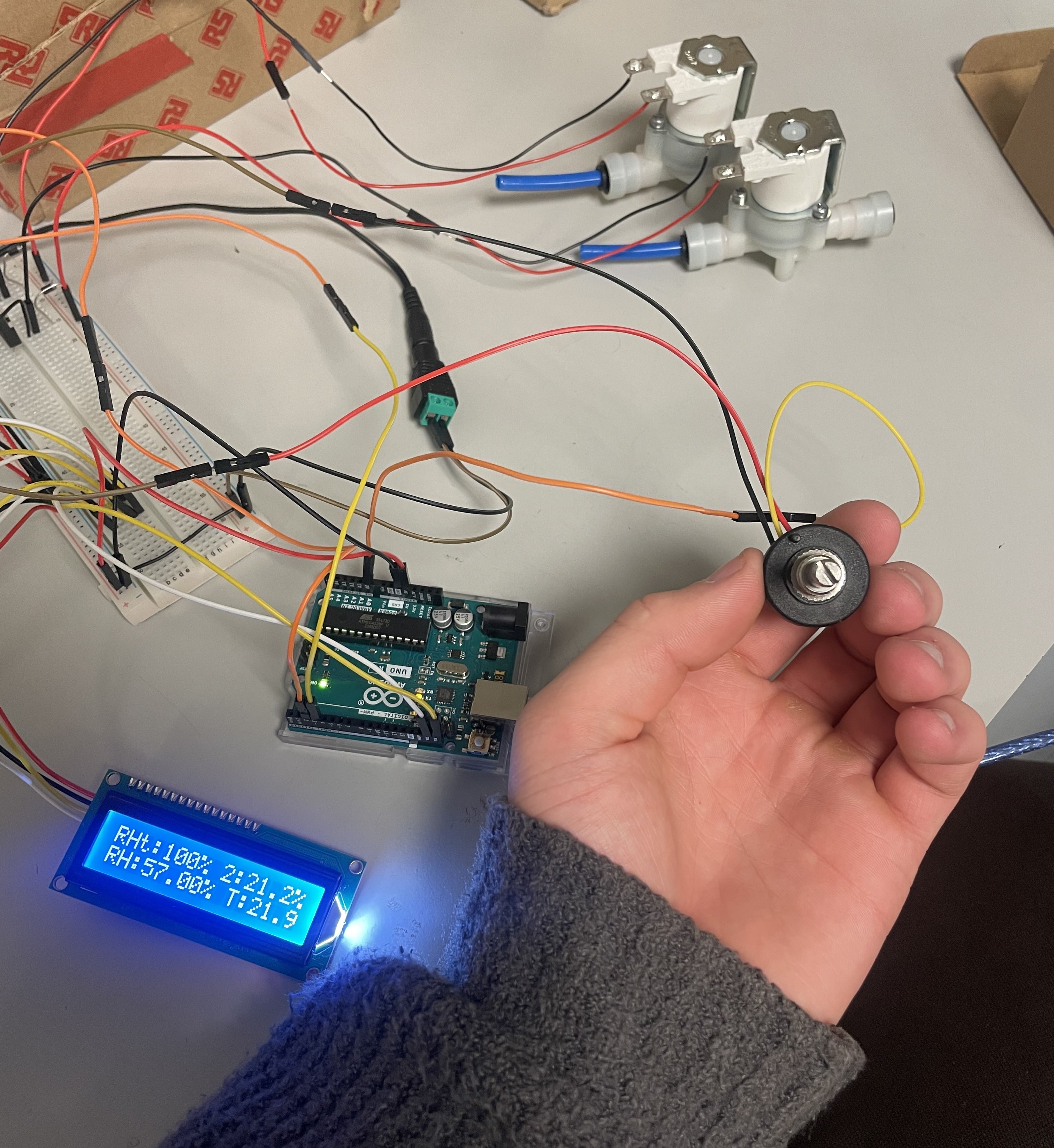 Breadboard circuit with solenoid valves, Arduino, and control knob